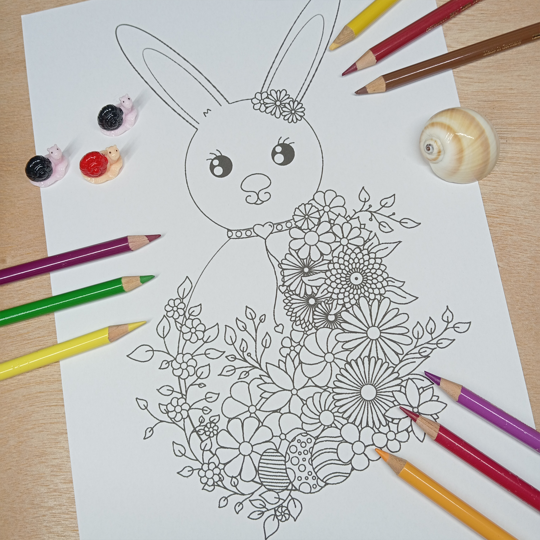 Osterhase mit Blumen – Malvorlage zum ausdrucken